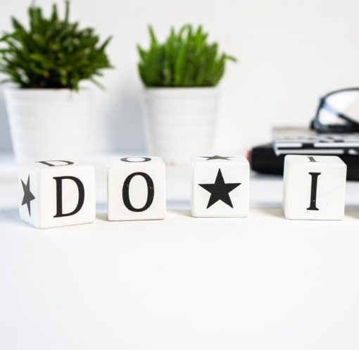 Inspiring office scene with 'Do It' blocks and plants, perfect for motivation.